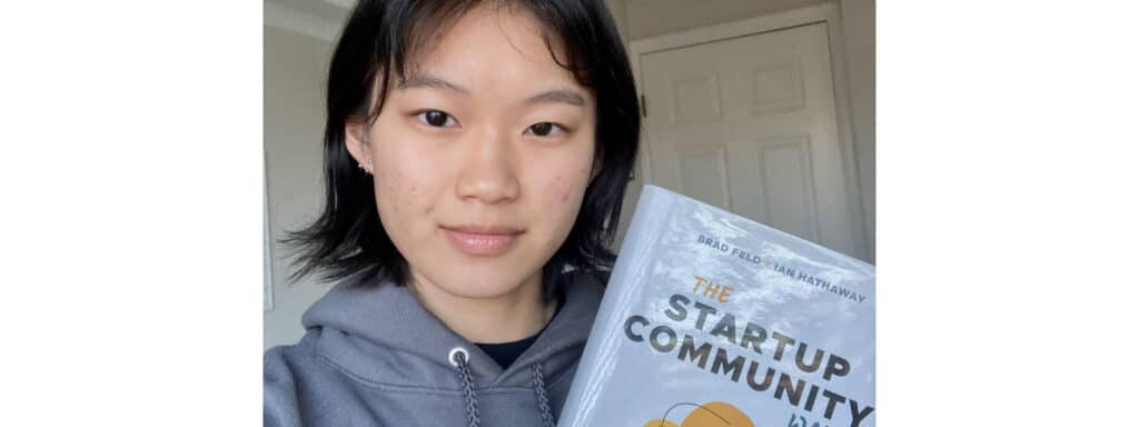 Joyce Liew with the book, The Startup Community Way