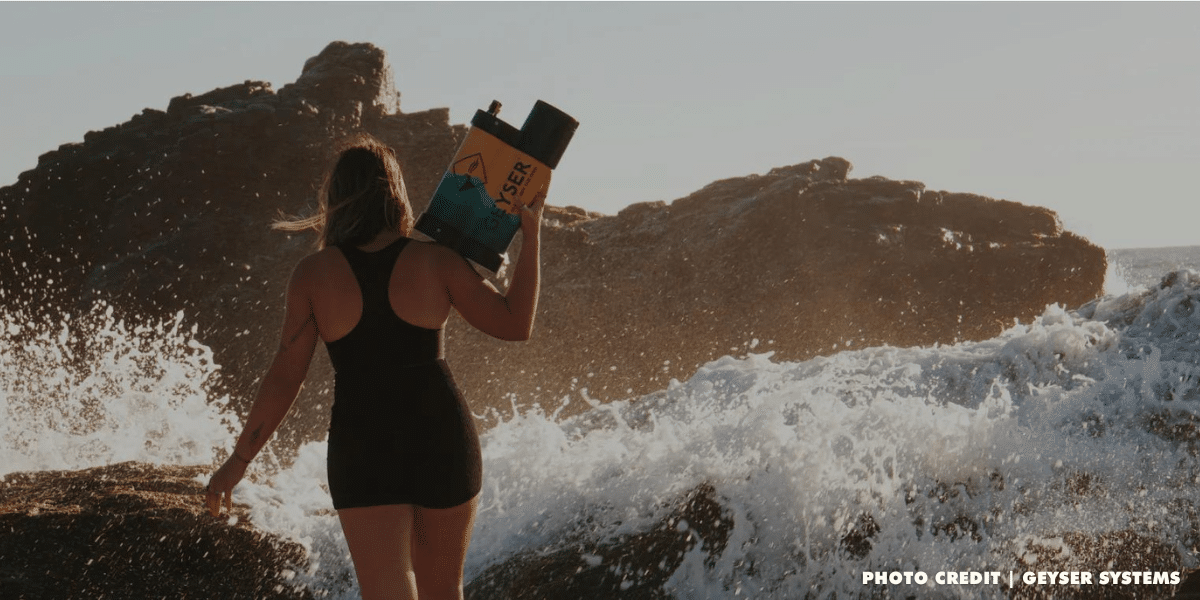 Woman on the beach holding a Geyser Systems product