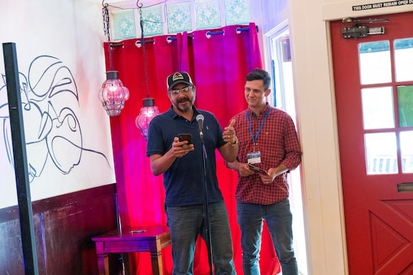 two men telling stories at an event